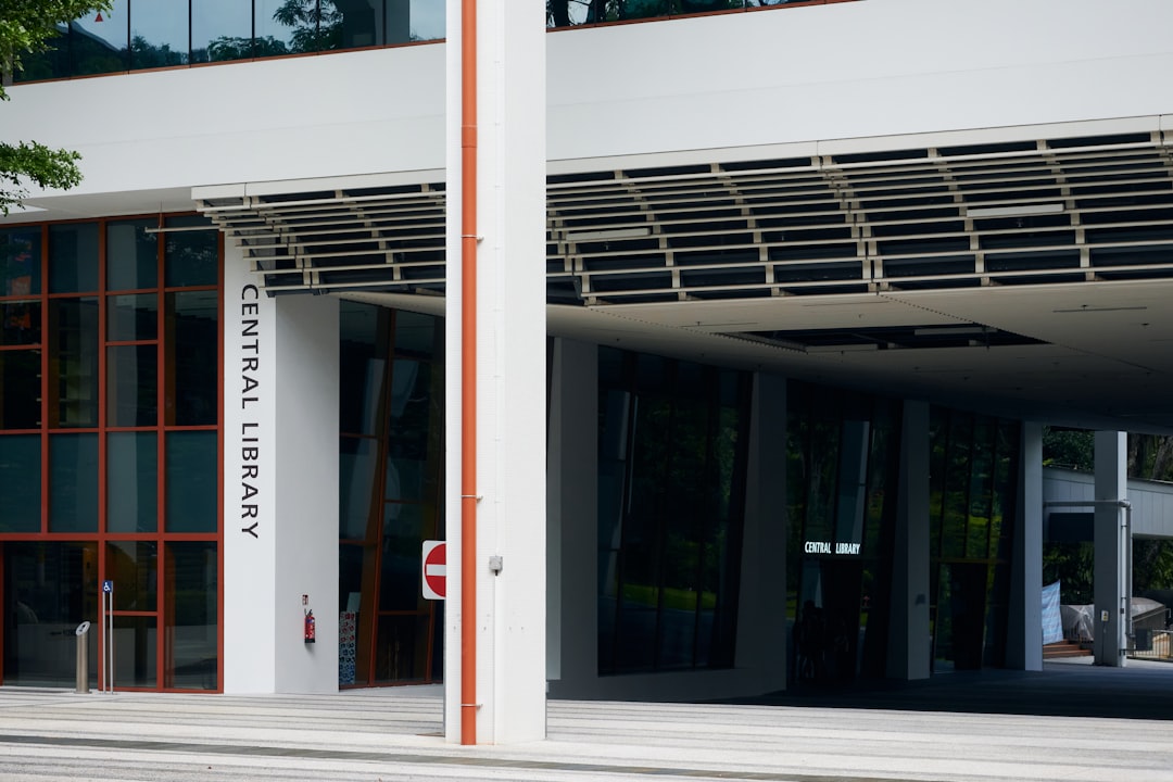 a white building with a red stop sign in front of it