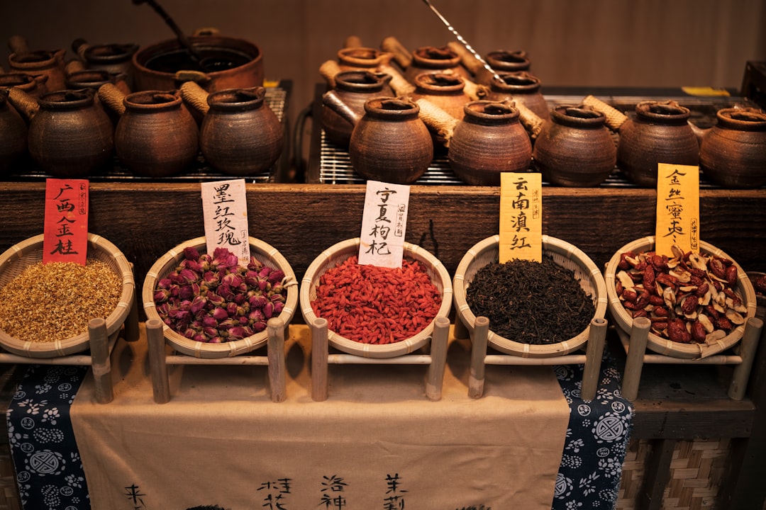 a variety of spices on display in bowls