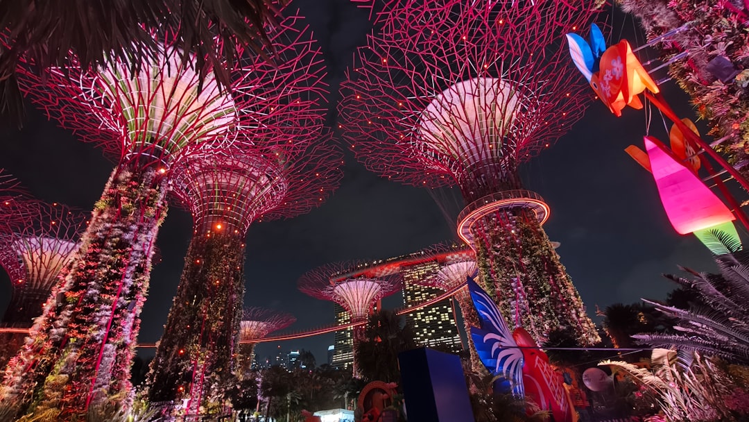 Futuristic glowing trees at night with colorful lanterns