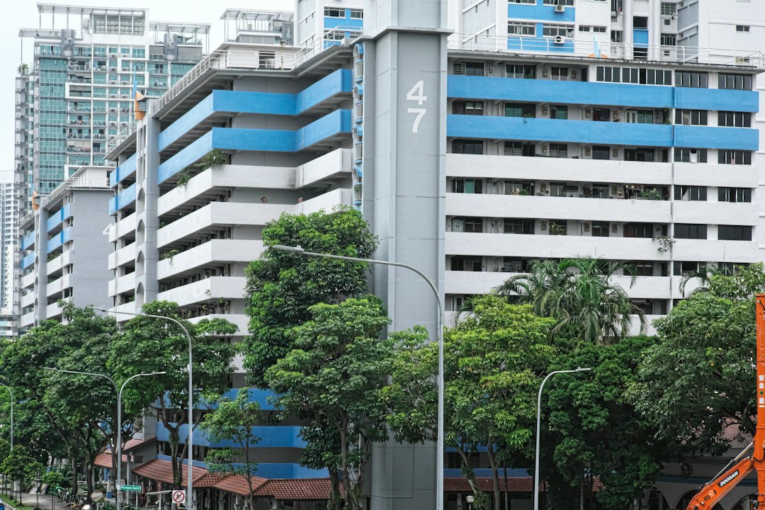 a city street with tall buildings in the background