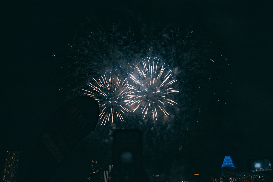 white and blue fireworks during nighttime
